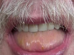 Old man tasting a stinky poop using his fingers